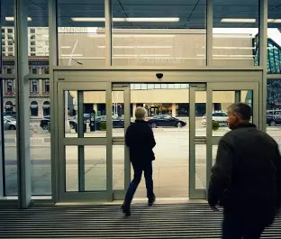 modern glass building with automatic doors