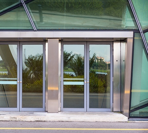 automated doors on contemporary glass building