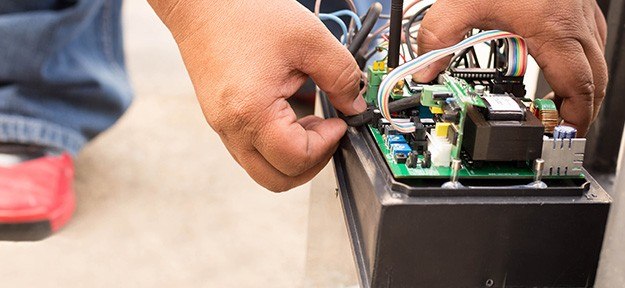 engineer repairing automatic door motor