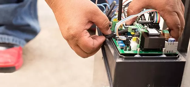 Automatic Door Repairs Nuneaton, Warwick, Coventry, Warwickshire - engineer repairing automatic door motor