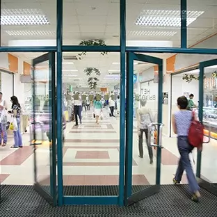 shoppers walking through glass doors - Automatic Door Servicing Nuneaton, Warwick, Coventry, Warwickshire